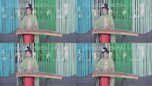 身穿中国传统汉服的女子弹奏古筝唯美画面高清在线视频素材下载