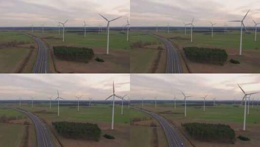 公路穿过农场中的风力涡轮机高清在线视频素材下载