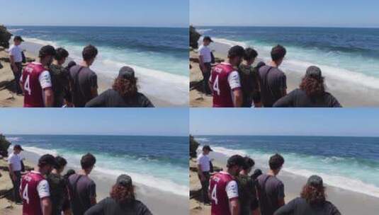 游客看着海浪涌向海岸高清在线视频素材下载