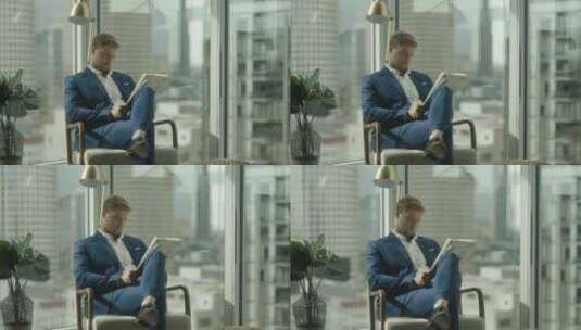 男人坐在办公室里读报纸高清在线视频素材下载