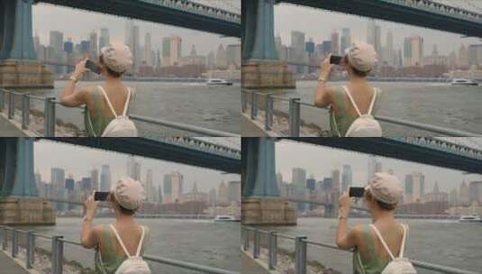 女人在桥上拍照片高清在线视频素材下载