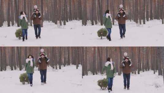 父亲带女儿在雪山玩耍高清在线视频素材下载