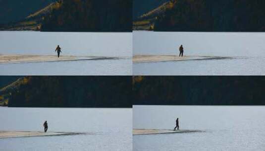 湖泊视频湖泊里拍照的摄影师游客人水一体高清在线视频素材下载