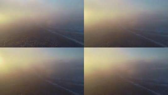航拍冬季山林雾凇冷空气朝阳高清在线视频素材下载
