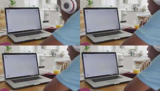 男孩带着耳机上在线课程的视频高清在线视频素材下载