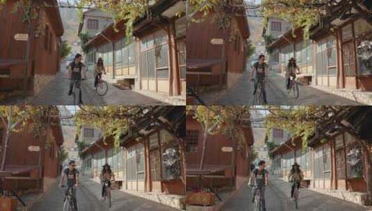 夫妇骑自行车上的街道高清在线视频素材下载