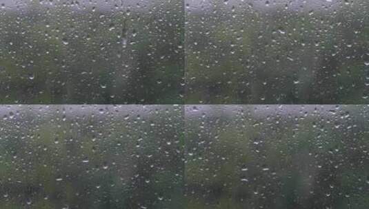 夏日雨中玻璃上的水珠高清在线视频素材下载