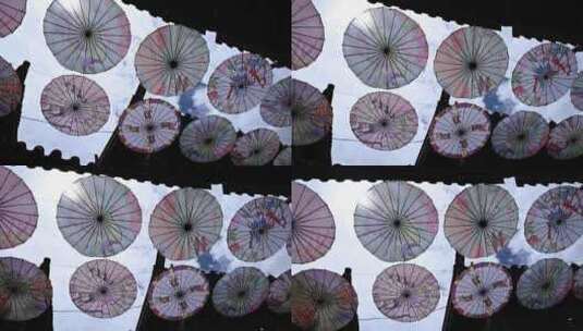 丽江古城的油纸伞风光高清在线视频素材下载