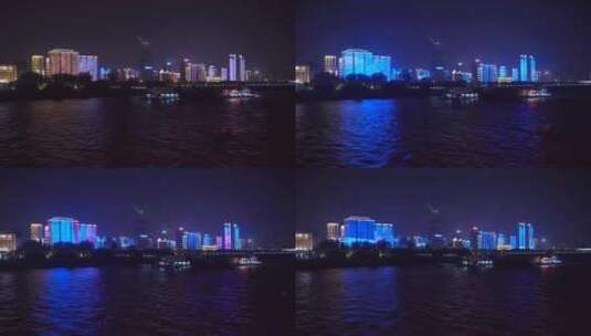 武汉汉江江滩夜景城市灯火大楼霓虹灯灯光秀高清在线视频素材下载