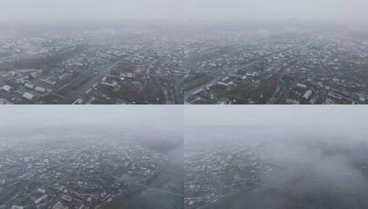 航拍大雪纷飞的新疆禾木村高清在线视频素材下载