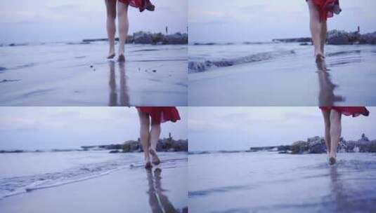 4K 实拍红衣女孩赤脚沿着海边走高清在线视频素材下载
