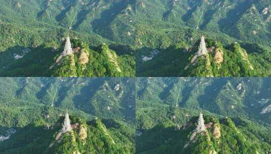 航拍千山绿色山林和大佛寺塔高清在线视频素材下载