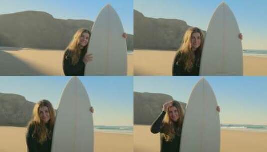 女孩拿着冲浪板站在沙滩上微笑高清在线视频素材下载