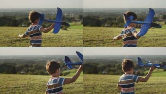 男孩拿飞机模型奔跑在草地上高清在线视频素材下载