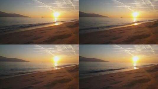 风平浪静的海滩上美丽的日落高清在线视频素材下载