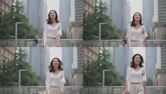 开心幸福都市女青年白领走在城市街头高清在线视频素材下载