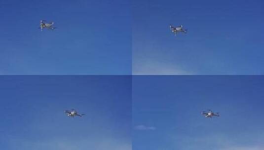 大疆多旋翼无人机在蓝天飞行高清在线视频素材下载