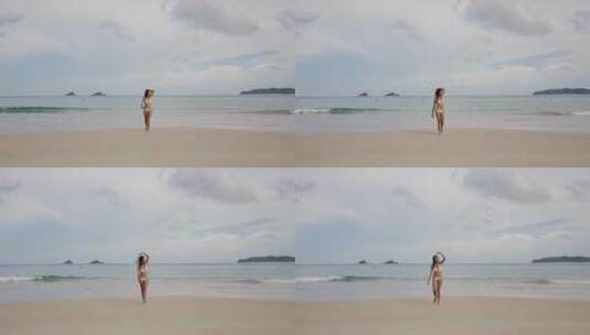 比基尼美女在海滩上散步高清在线视频素材下载