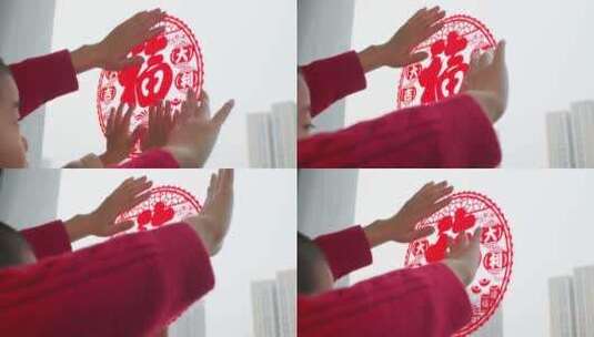 中国母子春节贴窗花高清在线视频素材下载