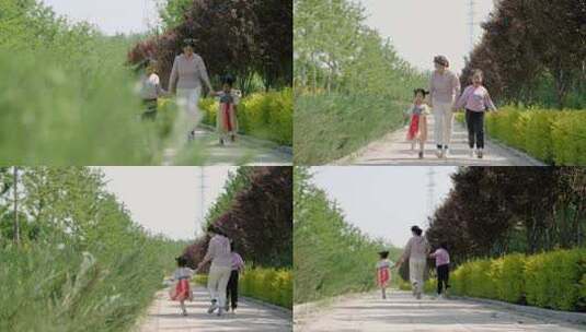 阳光下妈妈带着两个孩子走路奔跑高清在线视频素材下载