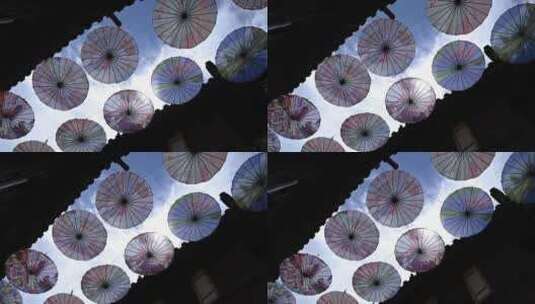 丽江古城的油纸伞风光高清在线视频素材下载