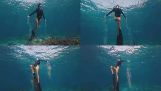 女潜水员在海底自由惬意吐着水泡高清在线视频素材下载