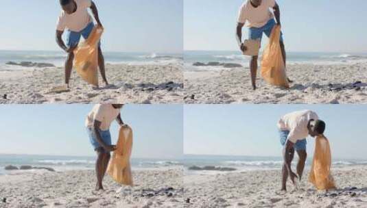 一个年轻的非裔美国人清理海滩，有复印空间高清在线视频素材下载