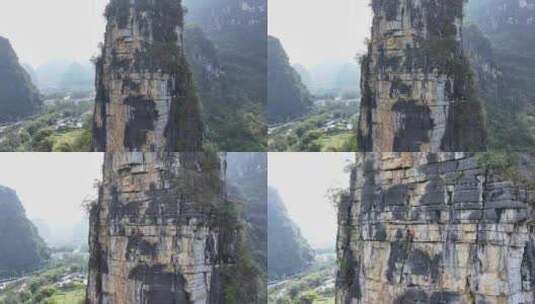 航拍结组攀登桂林阳朔拇指峰的攀岩者高清在线视频素材下载