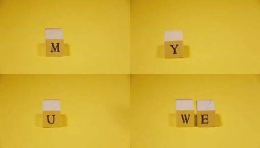 用黄色背景上的木制字母组成我、你、我们、高清在线视频素材下载